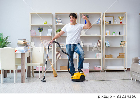 Man doing cleaning at home Man doing cleaning at home 33234366