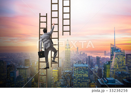 Businessman climbing career ladder in business 33236256