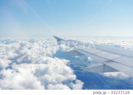 Clouds under the wing of an airplane 33237116
