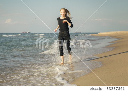 woman running at beach woman running at beach 33237861