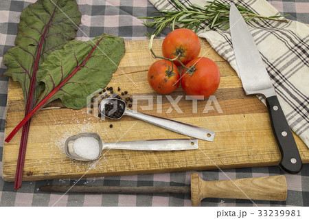 knife and cutting board with fresh vegetables meal 33239981