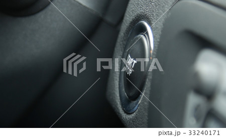 Macro engine start and stop button of a car. Macro engine start and stop button of a car. 33240171