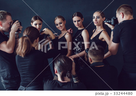 Photographers paparazzi take photos of women in Photographers paparazzi take photos of women in 33244480