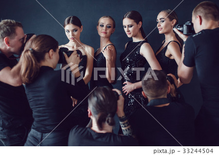 Photographers paparazzi take photos of women in 33244504