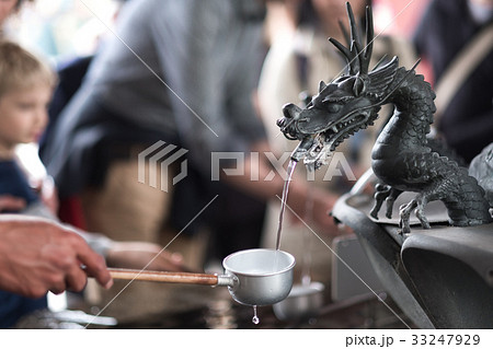 etal dragon spewing water at Senso-ji temple 33247929