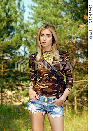 Attractive girl with backpack on hiking trail 33247949