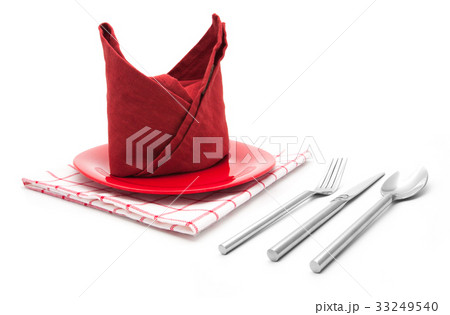 dinner seting fork and knife on red napkin 33249540