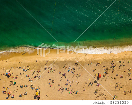 View from above to a busy beach. Atlantic Ocean View from above to a busy beach. Atlantic Ocean 33251039