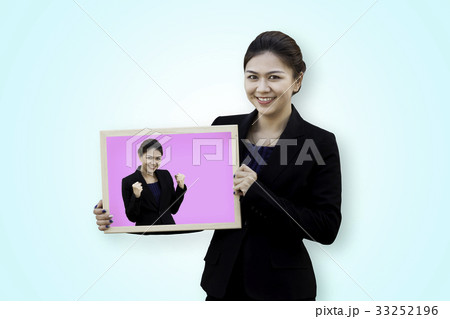 Business woman holding her self in white board 33252196