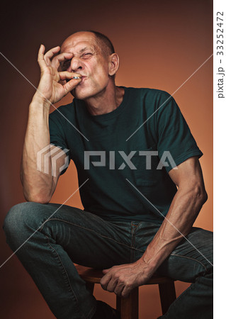 Worried mature man sitting at studio Worried mature man sitting at studio 33252472
