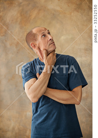 Worried mature man touching his head. Worried mature man touching his head. 33252550