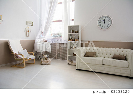 Interior of the room with a baby cot. 33253126