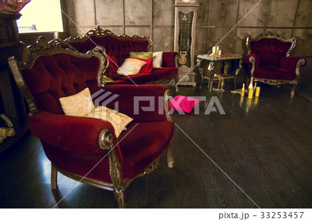 Beautiful antique room with red armchairs Beautiful antique room with red armchairs 33253457