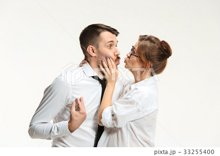 The business man and woman communicating on a gray 33255400