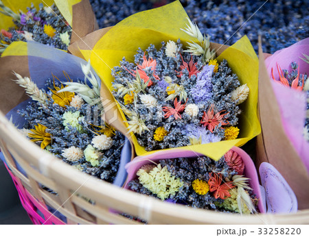 Bouquets of flowers in a basket on the market 33258220
