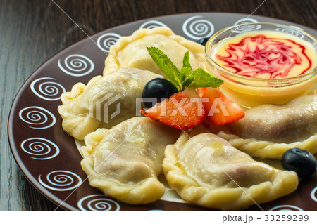 Delicious dumplings with cherries and jam 33259299
