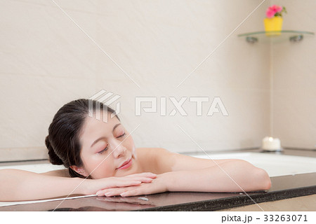 smiling woman feeling tired leaning on bathtub smiling woman feeling tired leaning on bathtub 33263071