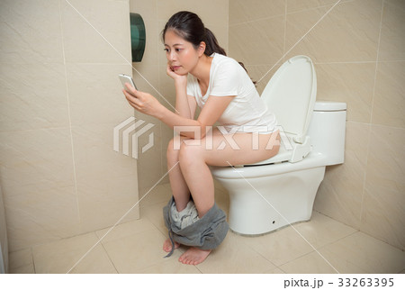 beautiful young woman using mobile cell phone 33263395