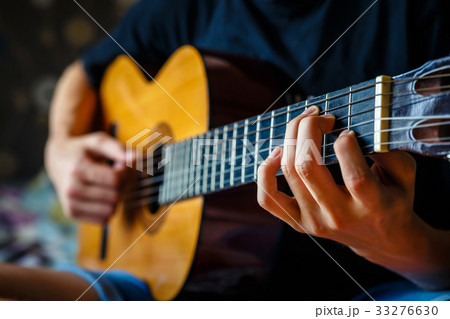 musician playing acoustic guitar, music background musician playing acoustic guitar, music background 33276630