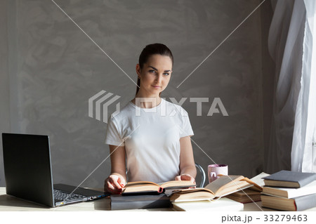 girl is preparing for the exam reading book works 33279463