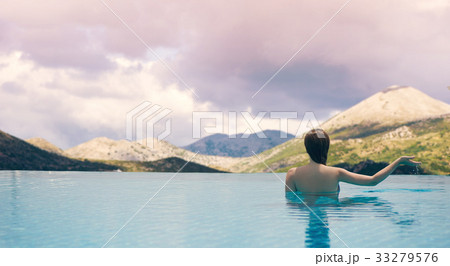 Young female in the pool on  roof in South Tyrol 33279576