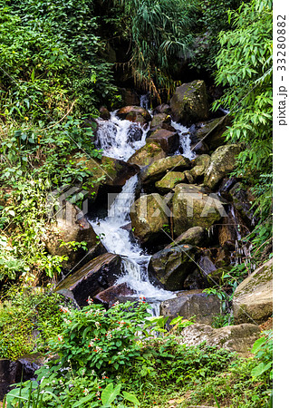 Beautiful waterfall in the jungle at sunny day Beautiful waterfall in the jungle at sunny day 33280882