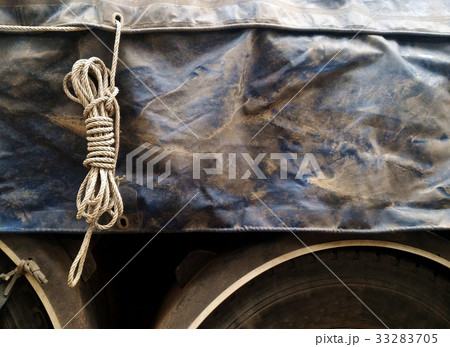 old rope loop and dirty old canvas covered truck o 33283705