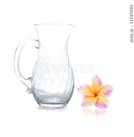 Empty glass jar and colorful plumeria flower Empty glass jar and colorful plumeria flower 33285094