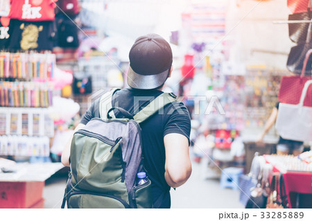 Young man traveler is visiting at Mongkok in Hong Kong Young man traveler is visiting at Mongkok in Hong Kong 33285889