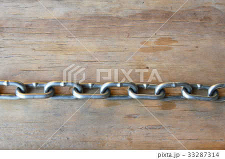 iron chain on wooden board 33287314