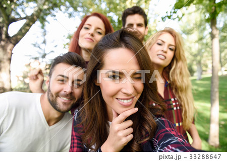 Group of friends taking selfie in urban background 33288647