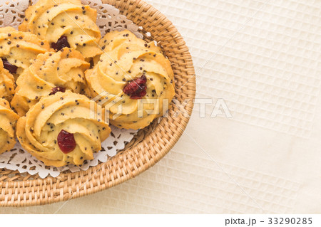 pile of cookies with dry cranberry and sesame 33290285