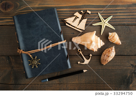 Notebook, sea shells and wooden ship 33294750