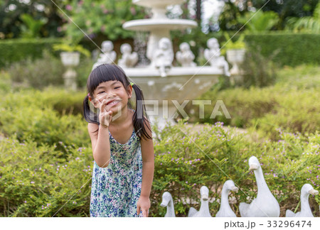 Happy girl in garden 33296474