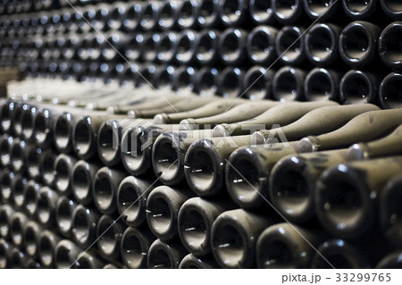 Wine or champagne bottles aged in cellar 33299765