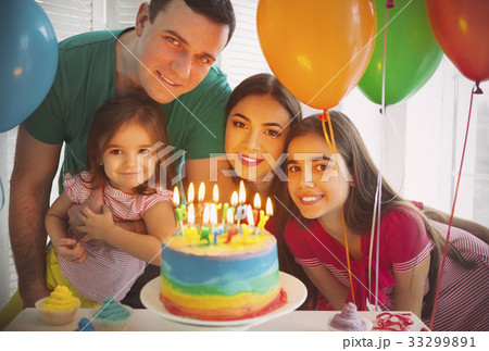 Portrait of family celebrating birthday 33299891