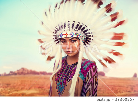 American Indian woman against mountain valley American Indian woman against mountain valley 33300557