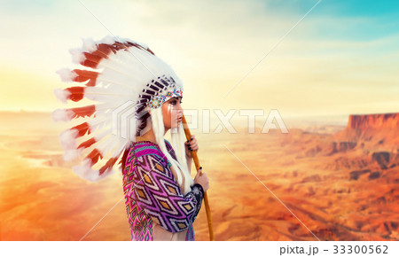 American Indian woman against mountain valley American Indian woman against mountain valley 33300562