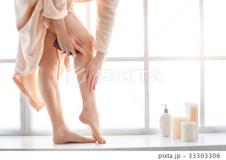 Young woman body care at home indoors 33303306