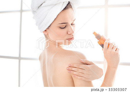 Young woman body care at home indoors 33303307