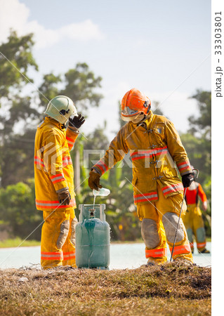Firefighter with fire and suit for protect. Firefighter with fire and suit for protect. 33303801