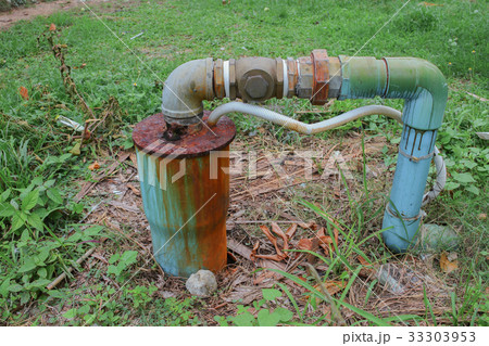 Water valve Plumbing Steel dilapidated on grass 33303953