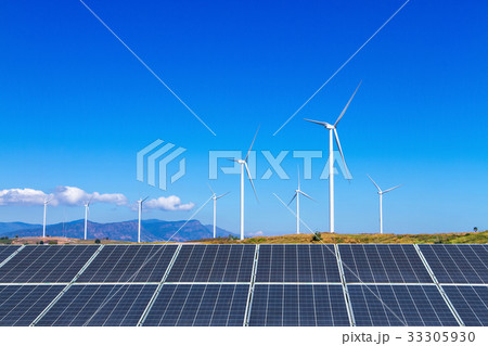 solar panels with wind turbines against mountanis 33305930