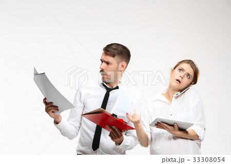 The business man and woman communicating on a gray 33308054