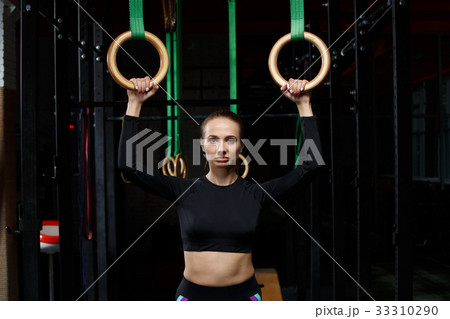 Exercises on rings. workout in dark gym 33310290
