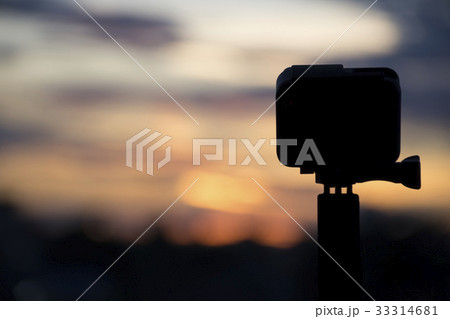 Silhouette Action camera on twilight sky Silhouette Action camera on twilight sky 33314681