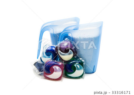 measuring cup with detergent isolated 33316171