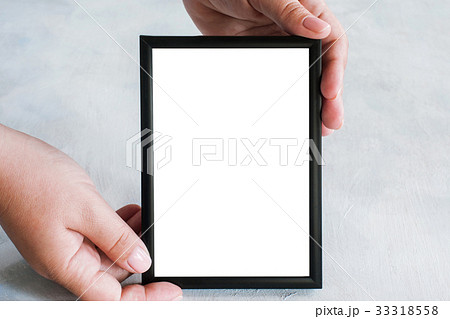 Picture frame tenderly holding in hands Picture frame tenderly holding in hands 33318558