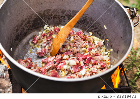 Traditional cooking in nature. Cauldron on fire 33319473