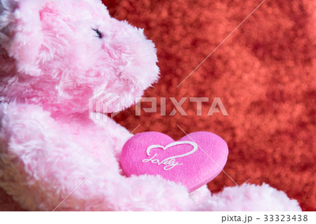 teddy Bear with Heart on red background 33323438